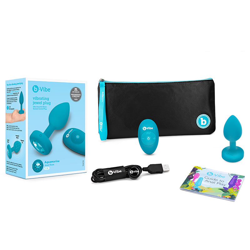 Plug anal recargable con control remoto b-Vibe Vibrating Jewel con base de gema color aguamarina S/M